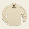 Beige shirt with button details on a light beige background