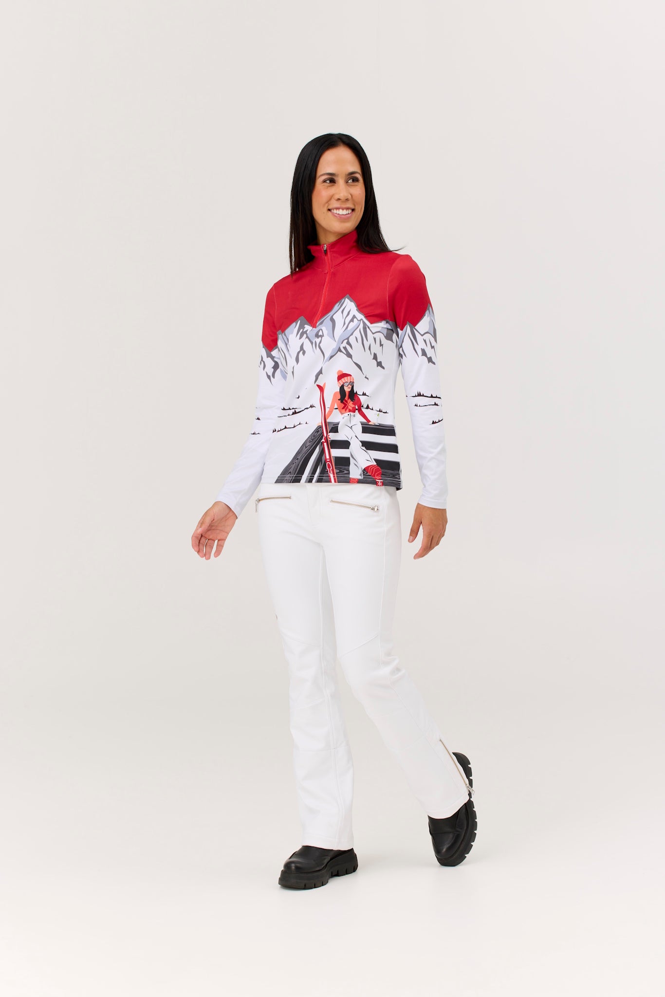 Person wearing a red and white ski suit with a graphic design on a white background