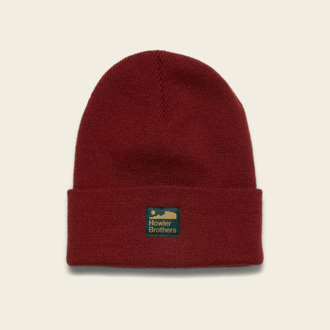Red beanie with a logo on a beige background