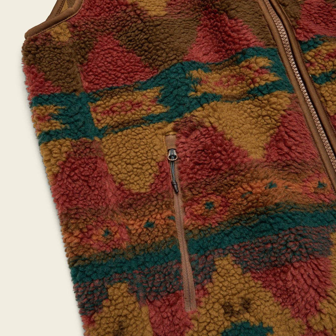 Multicolored textured fabric with a zipper on a beige background