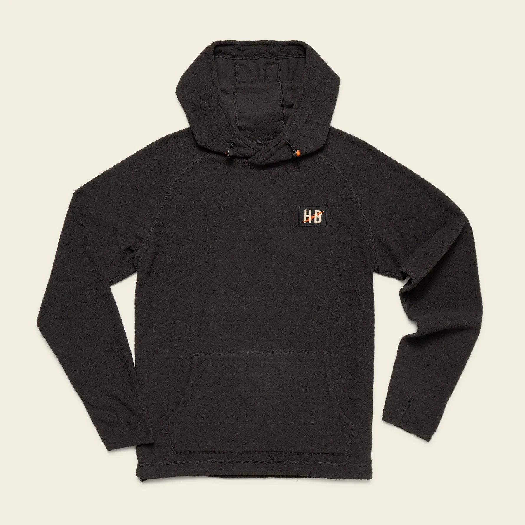 A black pullover hoodie with a small gold embroidered 'HB' logo on the left chest, displayed flat against a solid white background.
