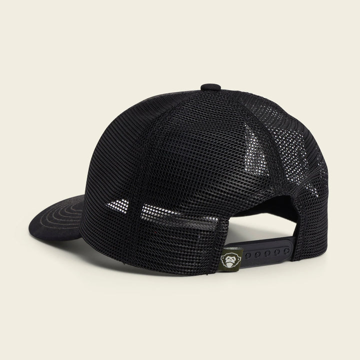 Black mesh cap on a beige background