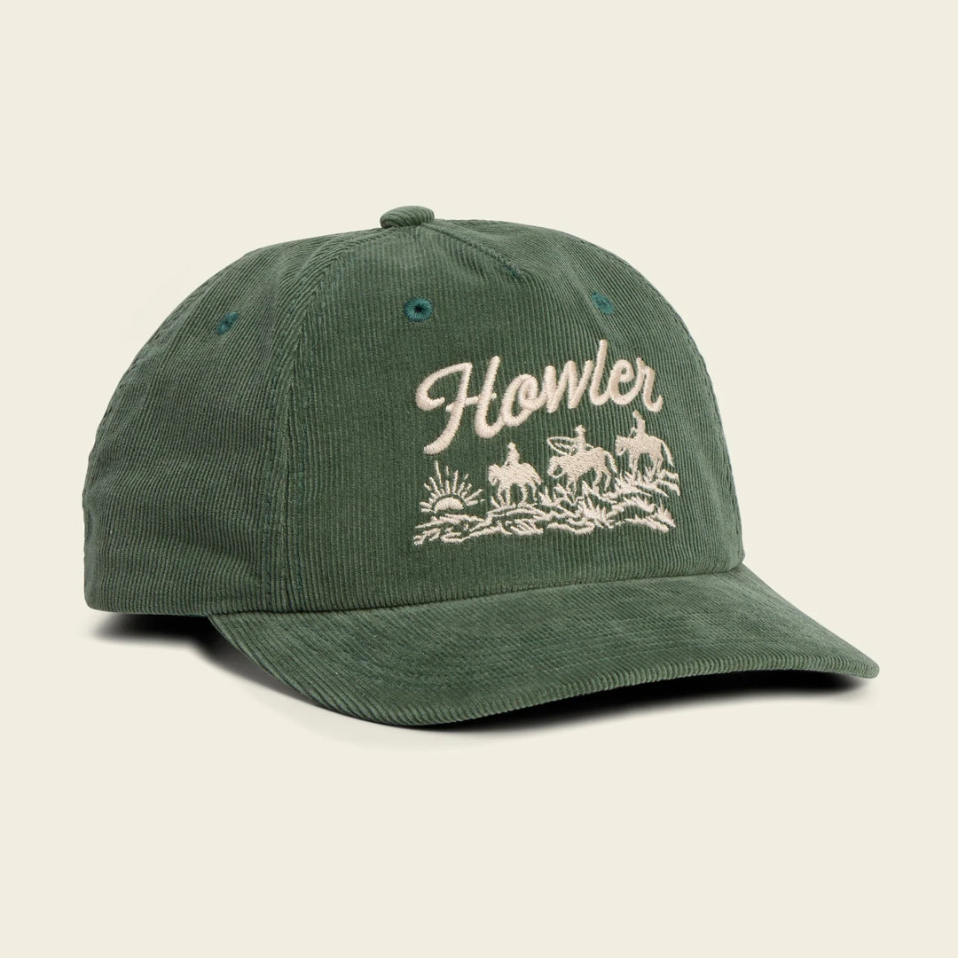 Green cap with 'Howler' logo on a beige background