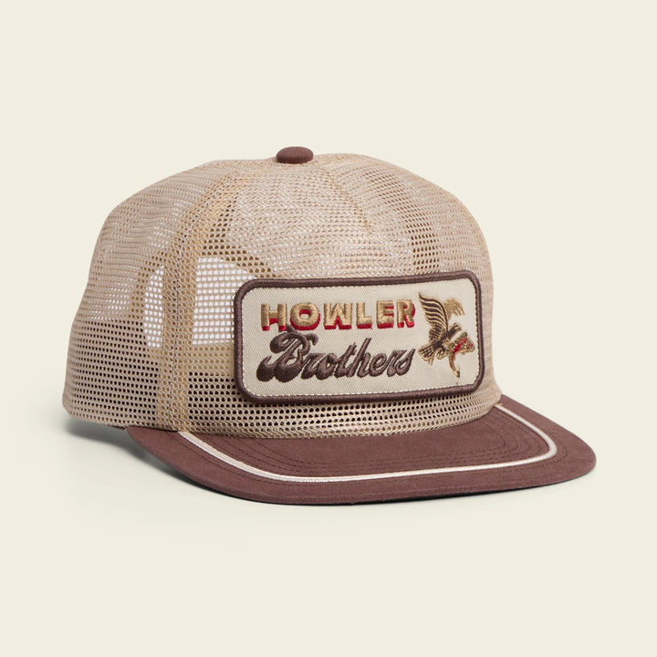 Beige and brown trucker hat with 'Howler Brothers' logo on a beige background