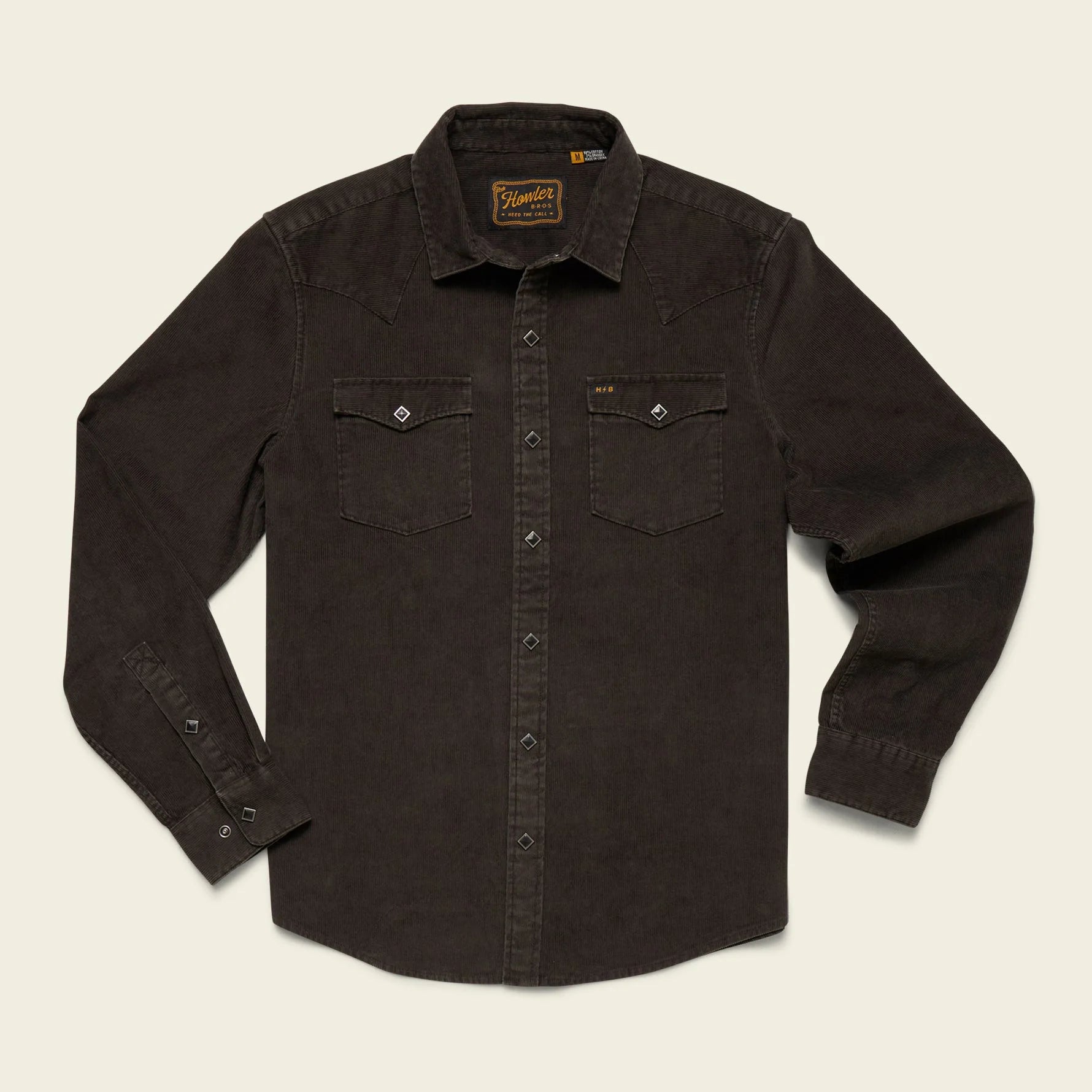 Dark brown button-up shirt with a brand logo on a beige background