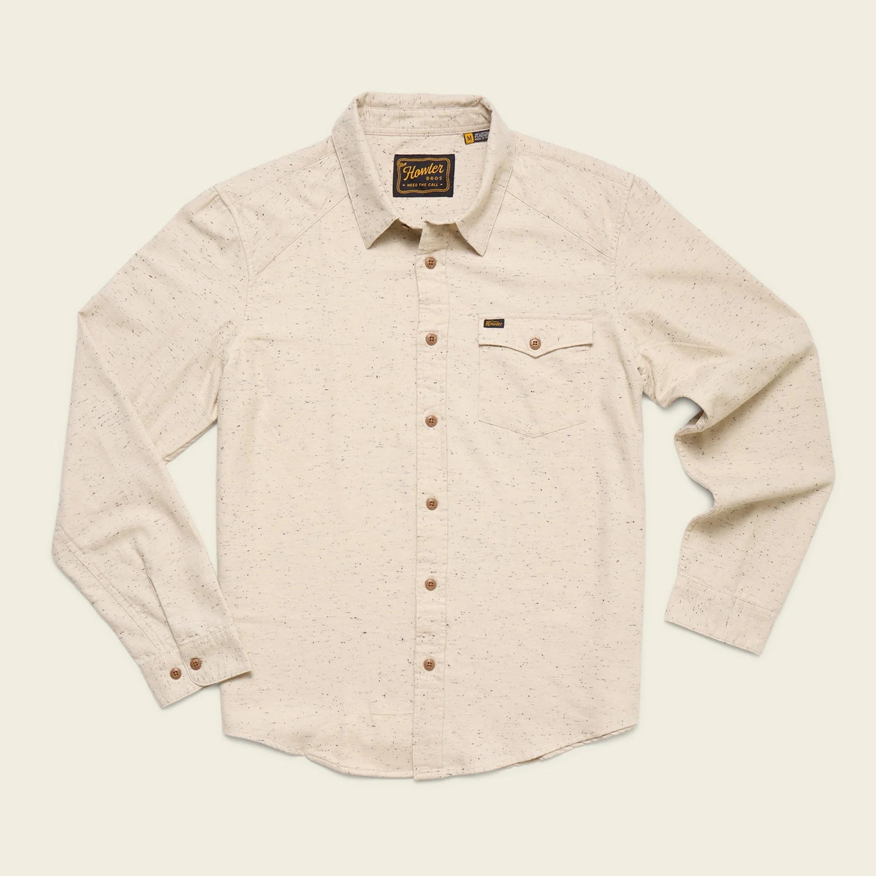 Beige Howler Brothers button-up shirt on a light beige background