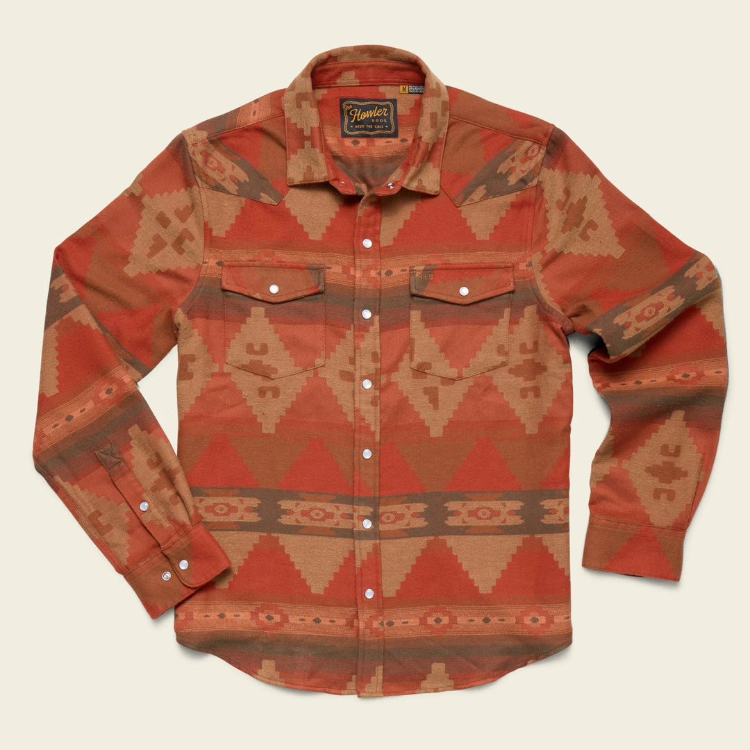 Red and brown patterned shirt with brand label on a beige background