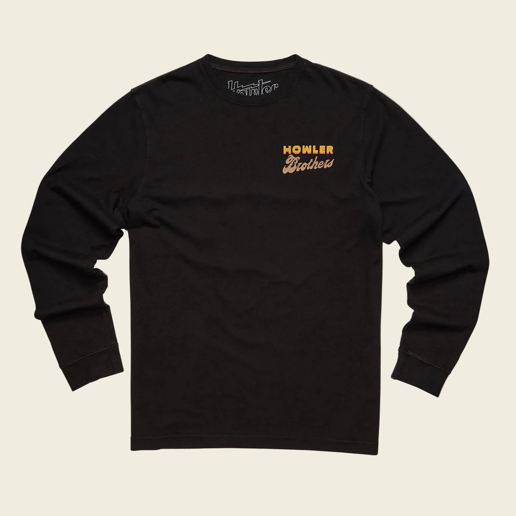 Black long-sleeve shirt with 'Howler Brothers' logo on a beige background