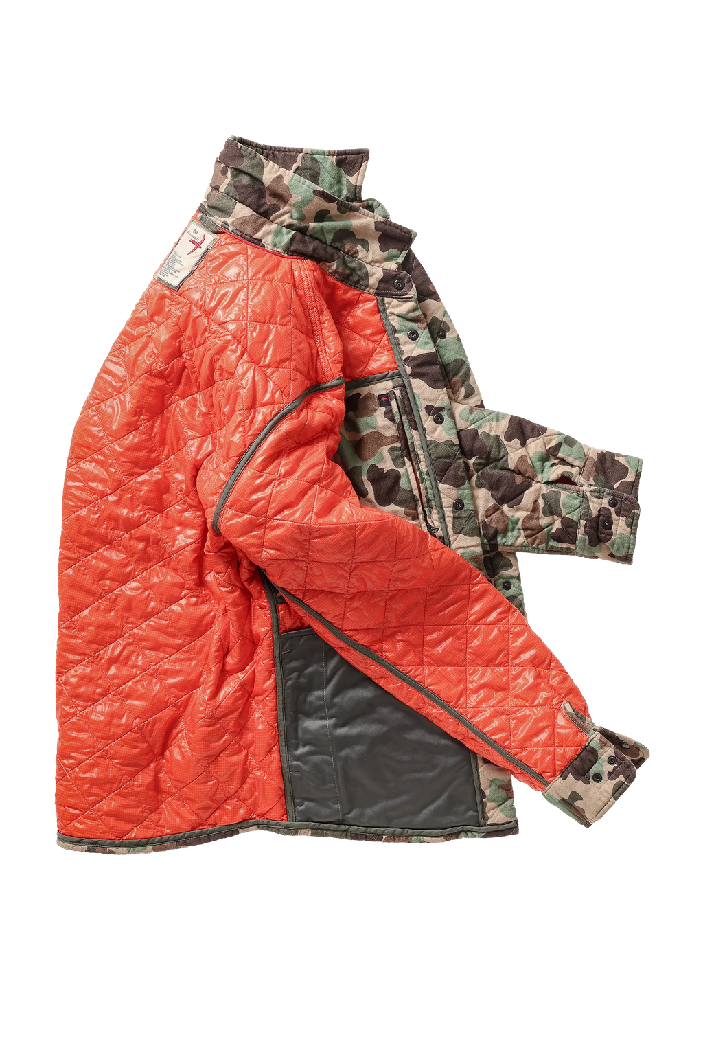 A quilted jacket with a bright orange-red front panel, camouflage patterned sleeves and collar, and a black zippered pocket on the lower front, shown on a plain white background.