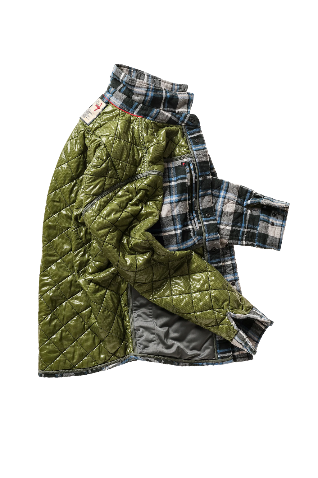 An olive green quilted jacket with a high collar, layered over a blue, white, and gray plaid flannel shirt. The jacket is shown open, revealing a gray interior lining, set against a plain white background.