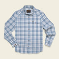A light blue and white plaid long-sleeve button-up shirt with a chest pocket, laid flat on a light beige background. The brand label on the inner collar reads 'Rip Curl'.