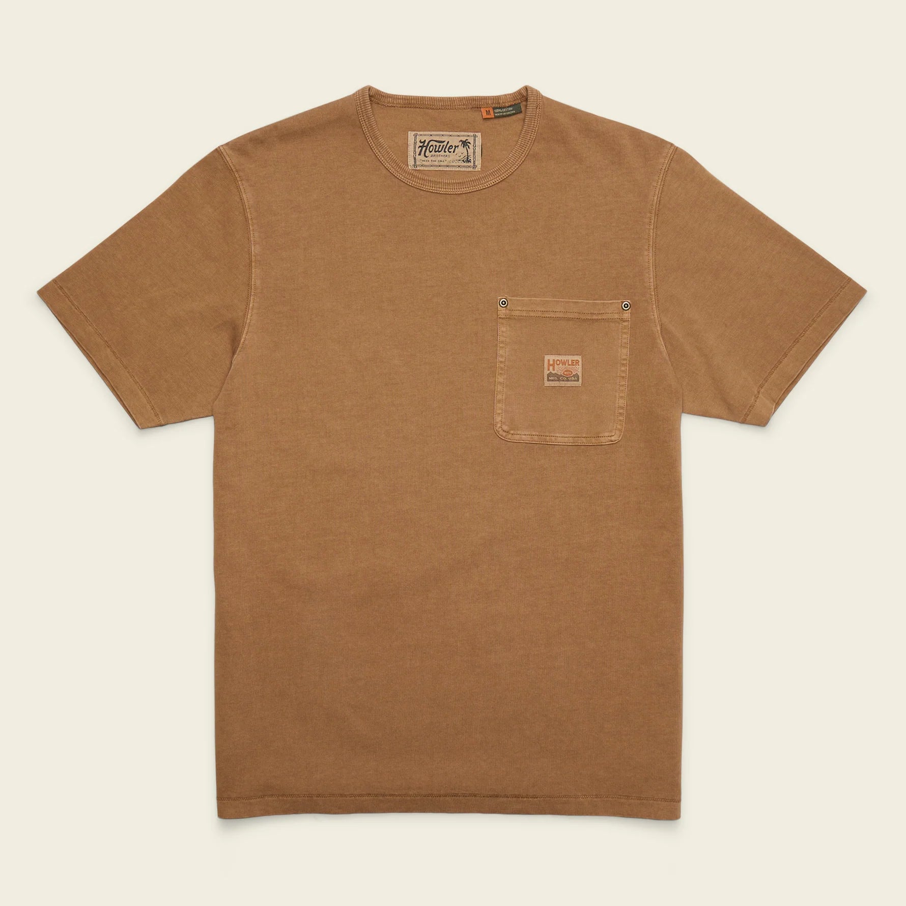 A brown short-sleeve crewneck t-shirt with a chest pocket, laid flat against a light cream background. The pocket features a small brown leather brand patch, and the inner neck label reads 'Fossil'.
