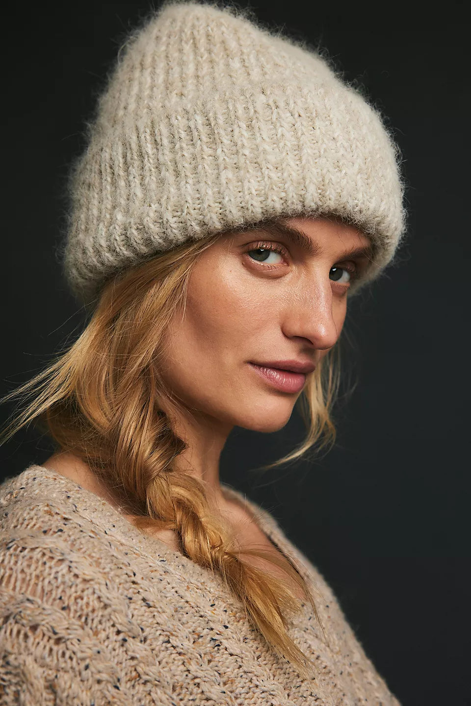 Free People Frostline Beanie in Ivory on model wearing an ivory sweater with black background