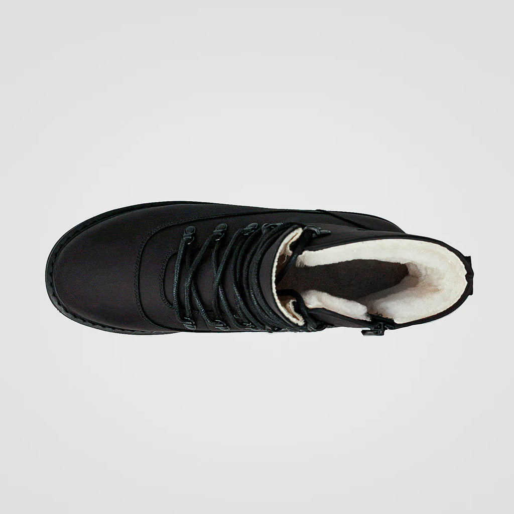 Black winter boot with white lining on a light gray background