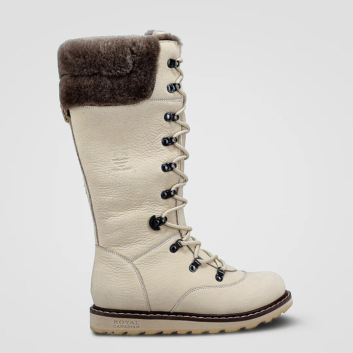 Beige winter boot with fur lining on a light gray background