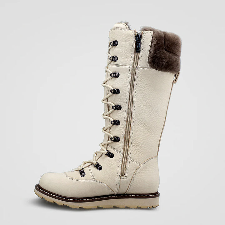 Beige winter boot with fur cuff on a light gray background