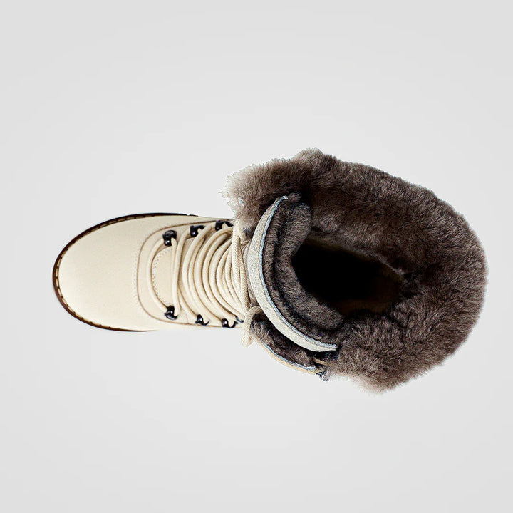 Pair of winter boots with fur lining on a light gray background