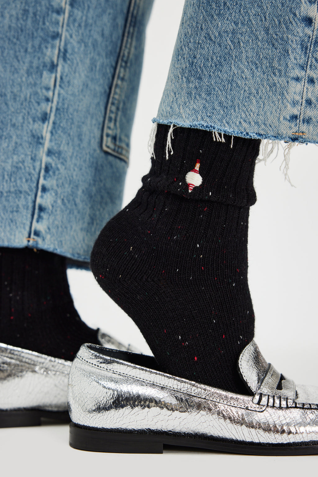 Free People Holiday Heritage Sock Pack -black sock with embroidered ornament on ankle shown on a model's foot with silver shoes