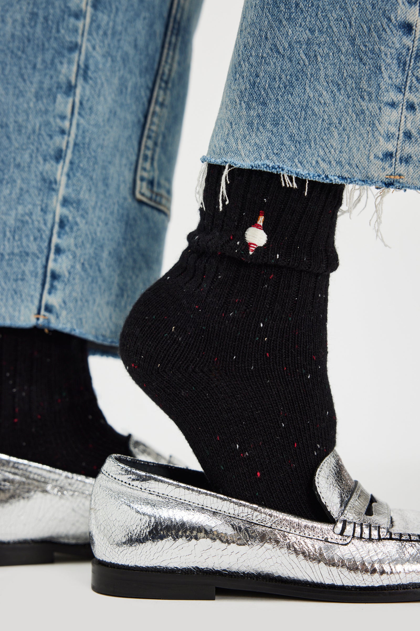 Free People Holiday Heritage Sock Pack -black sock with embroidered ornament on ankle shown on a model's foot with silver shoes