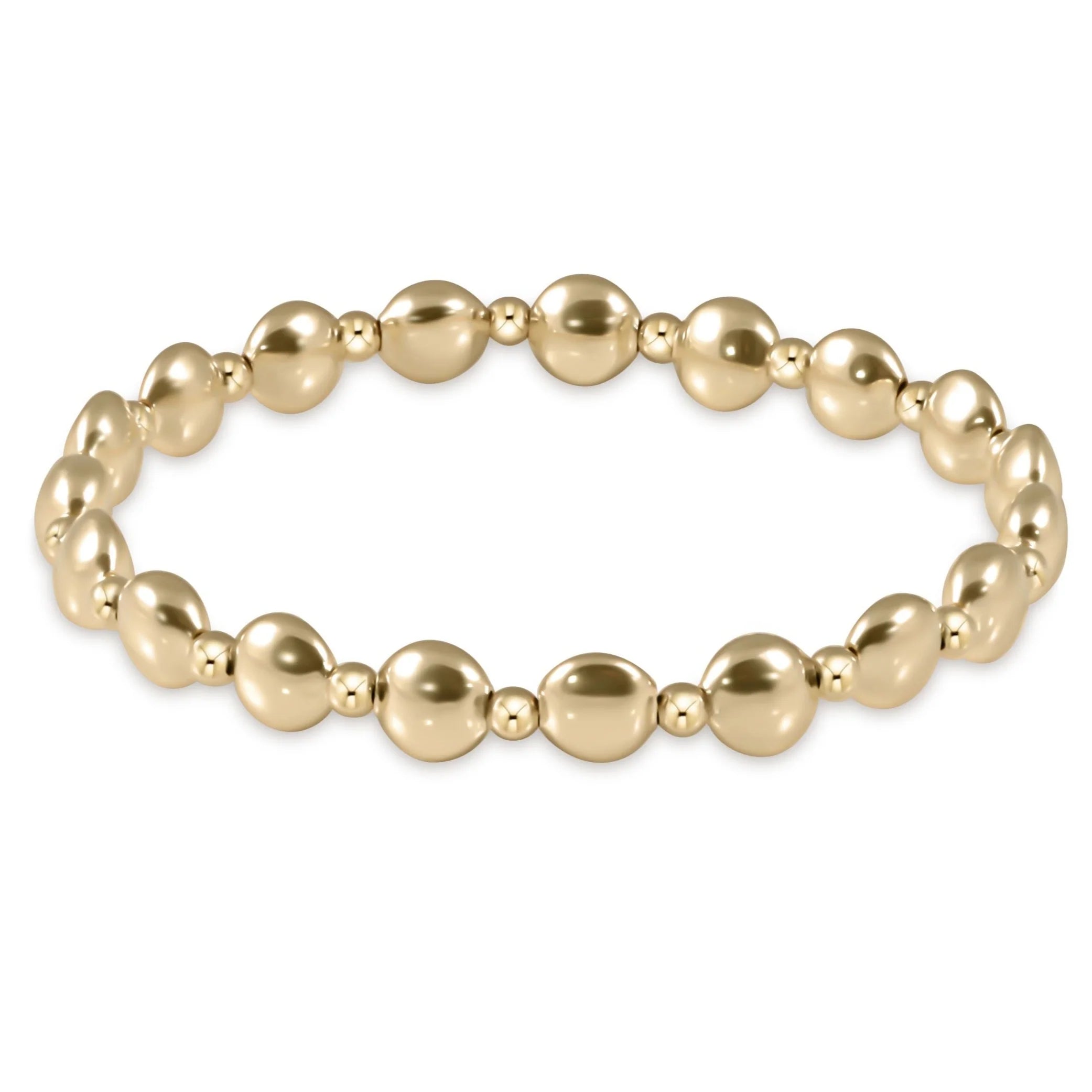 Gold beaded bracelet on a white background