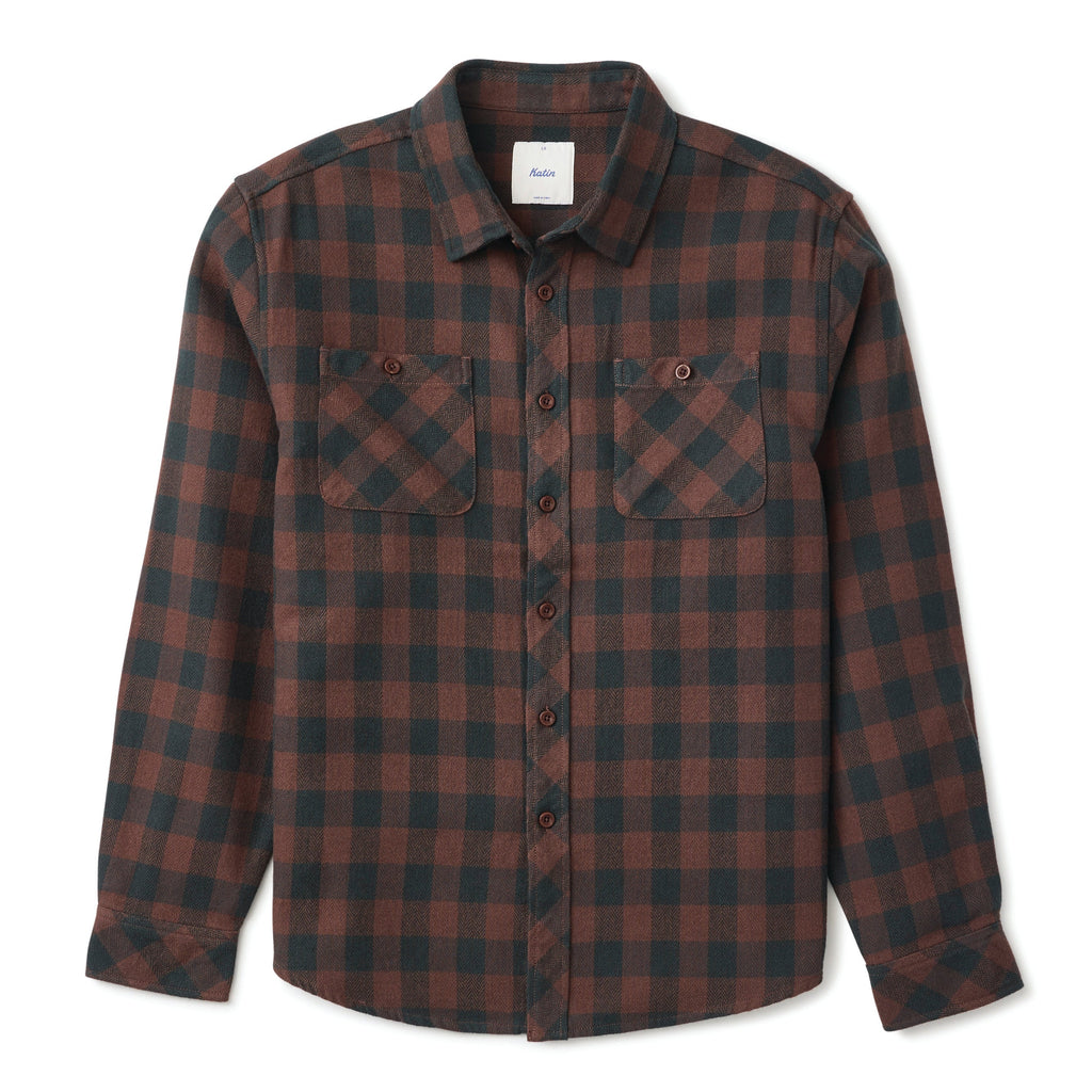 A long-sleeve button-up flannel shirt with a dark brown and black plaid pattern, featuring two chest pockets, shown on a light gray background.