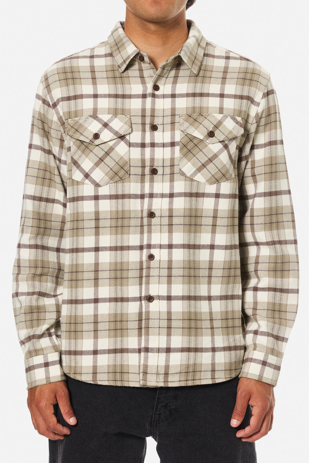 Plaid shirt worn by a person on a white background