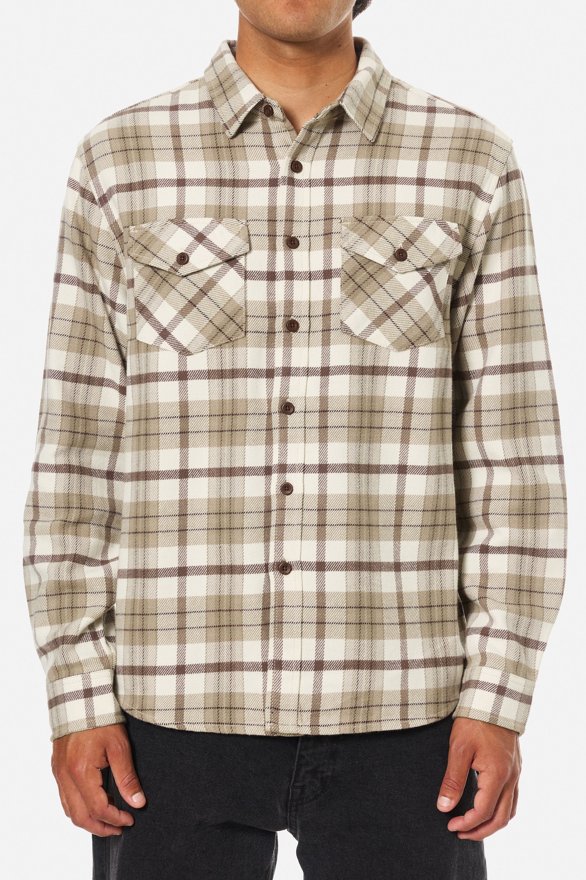 Plaid shirt worn by a person on a white background