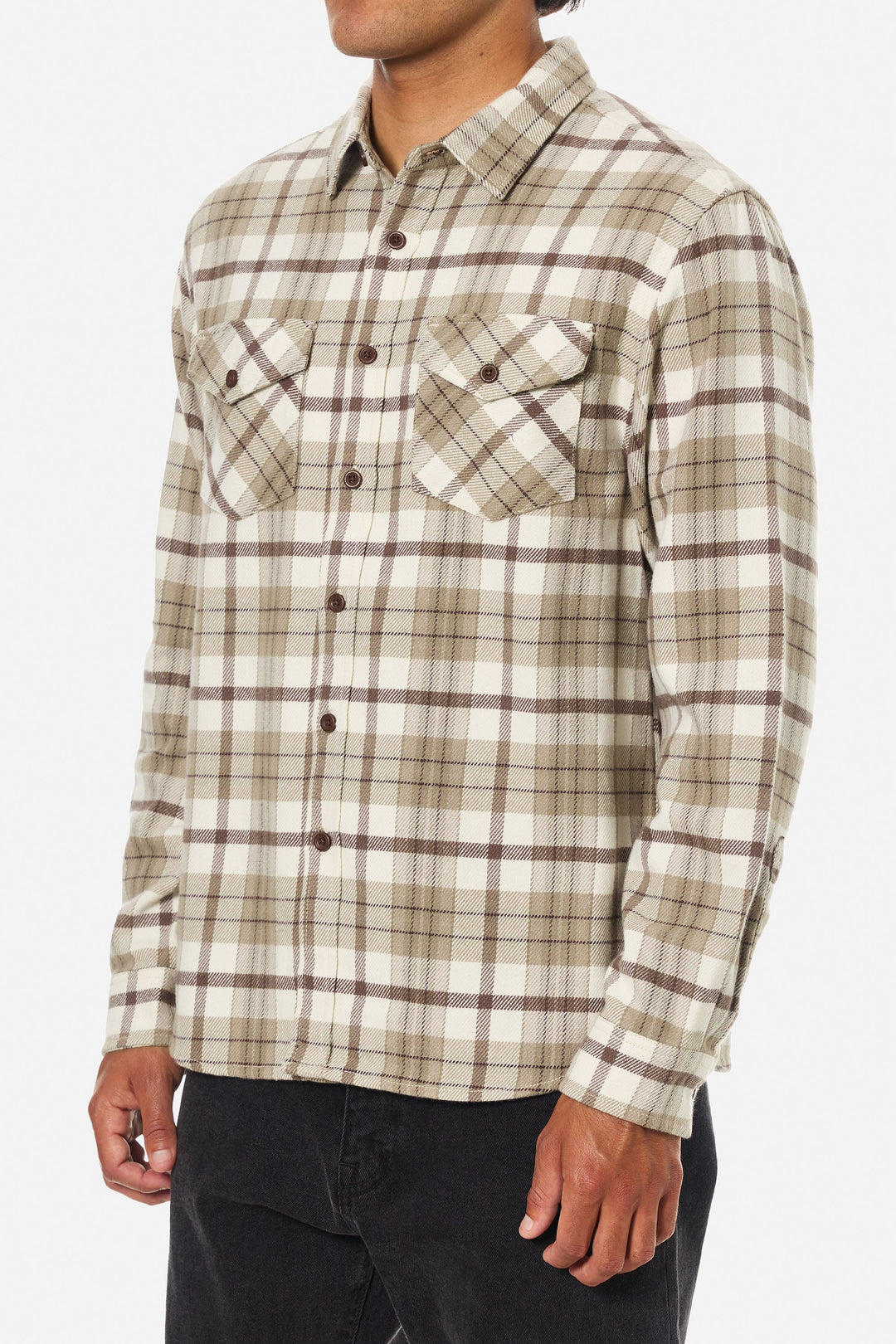 Plaid shirt worn by a person on a white background