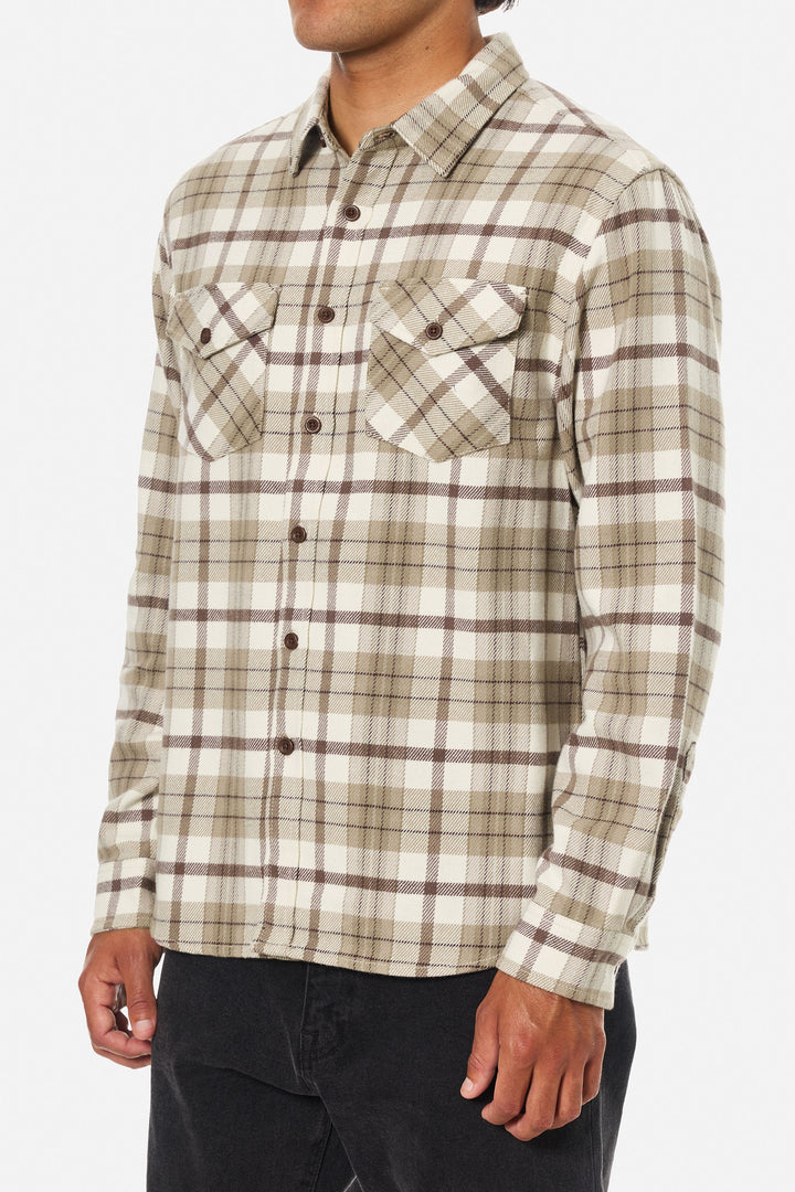 Plaid shirt worn by a person on a white background