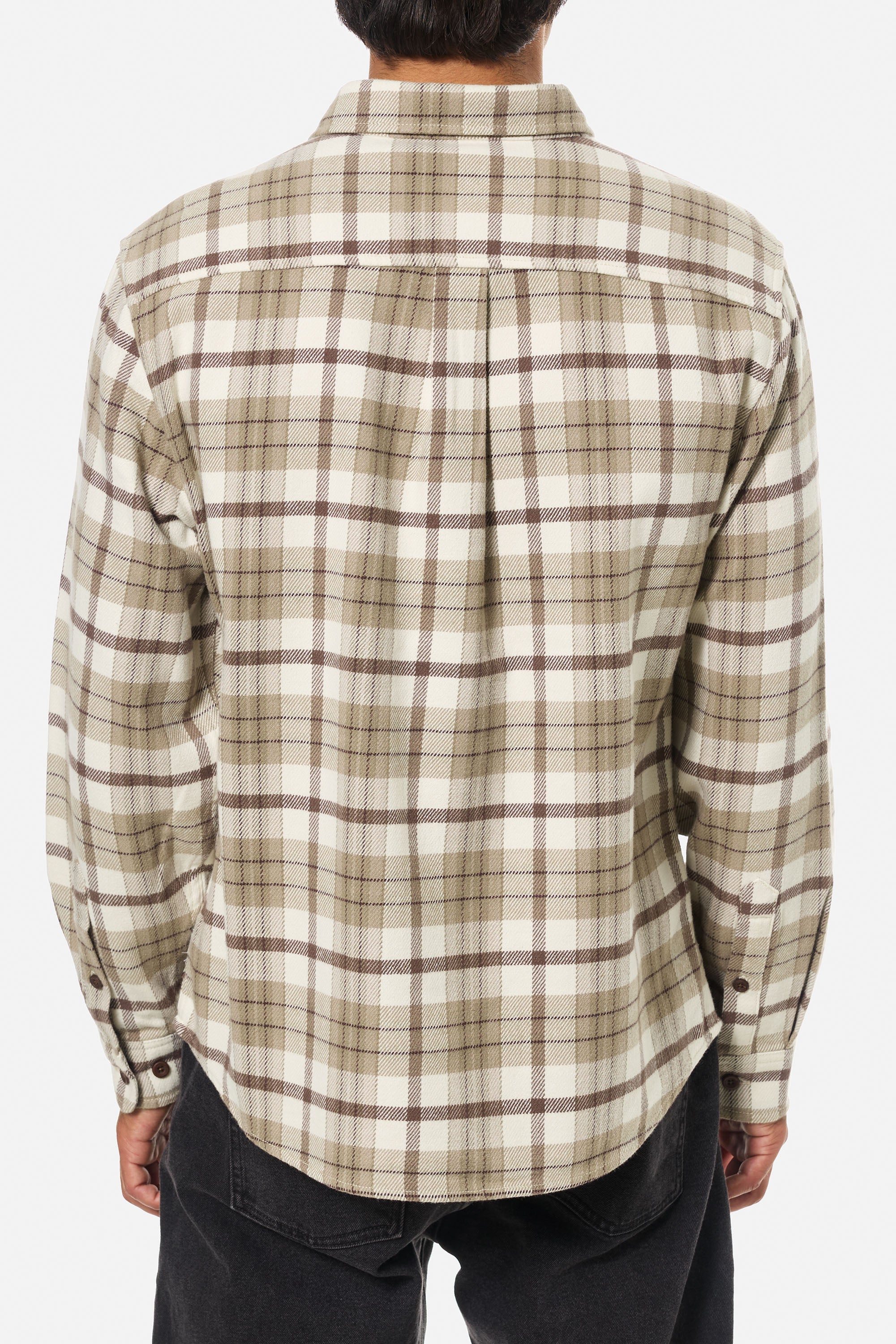 Plaid shirt worn by a person on a white background