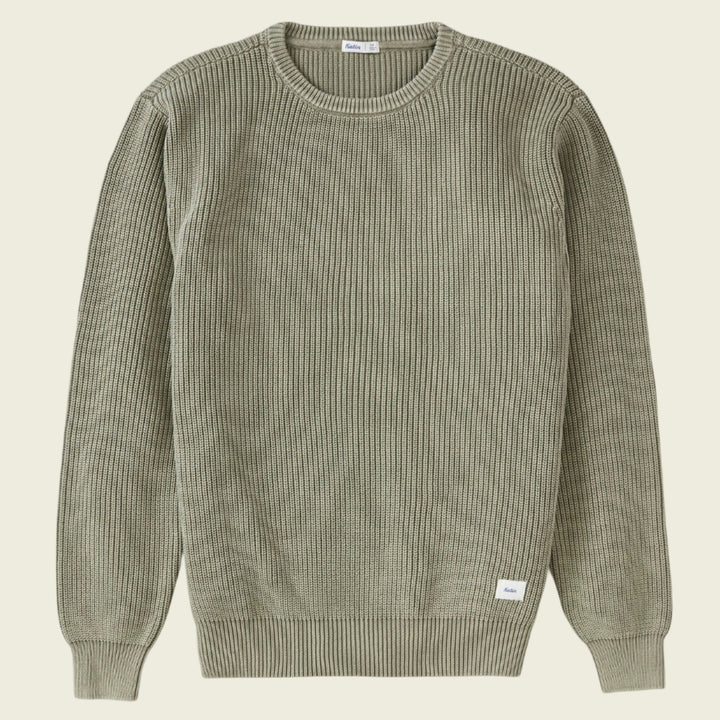 Green ribbed sweater on a white background