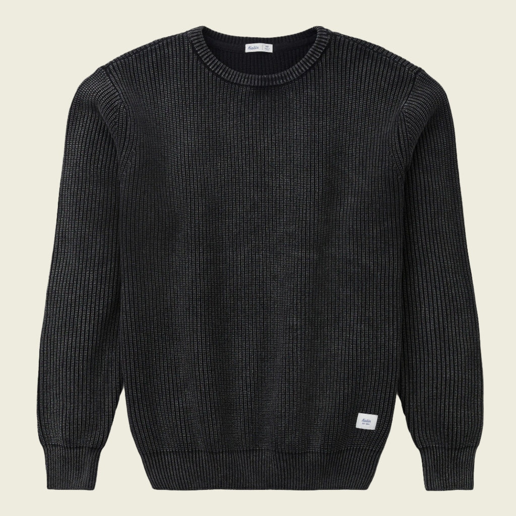 Black ribbed sweater on a white background