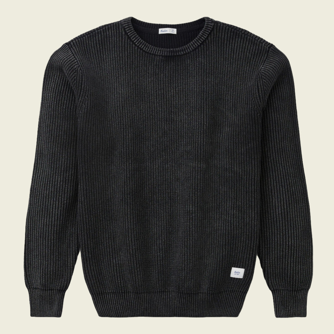 Black ribbed sweater on a white background
