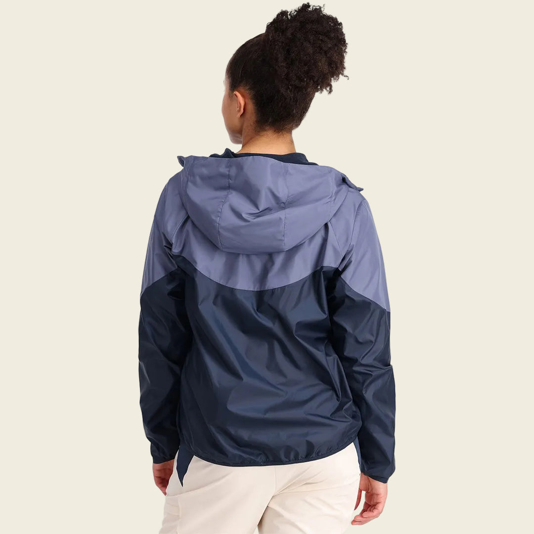 Person wearing a two-tone raincoat with a white background