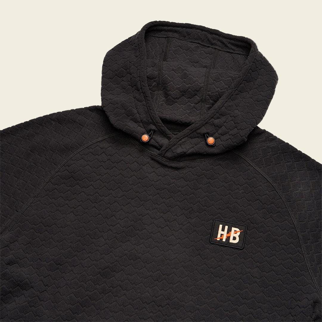 Black quilted jacket with a brand logo on a white background