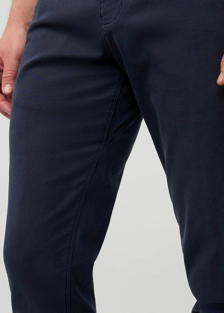 Navy blue pants on a light gray background