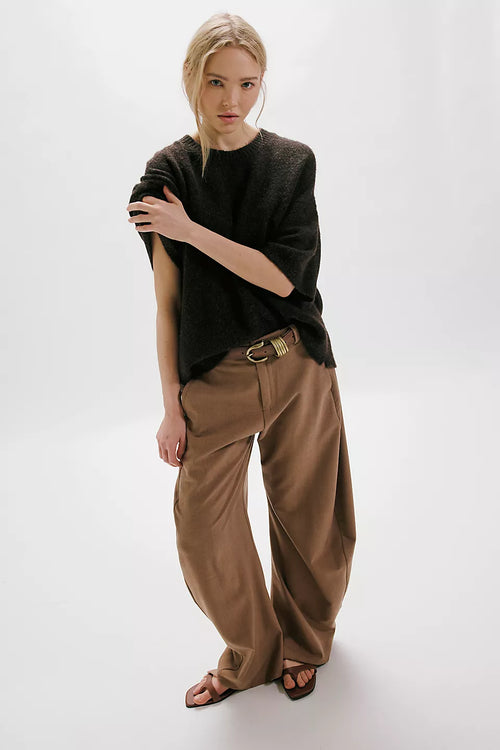 Free People Margot SoftSpun Sweater Tee in Black on model paired with brown pants