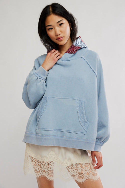 Free People Countryside Hoodie in Autumn Sky on model wearing a lace skirt with white background
