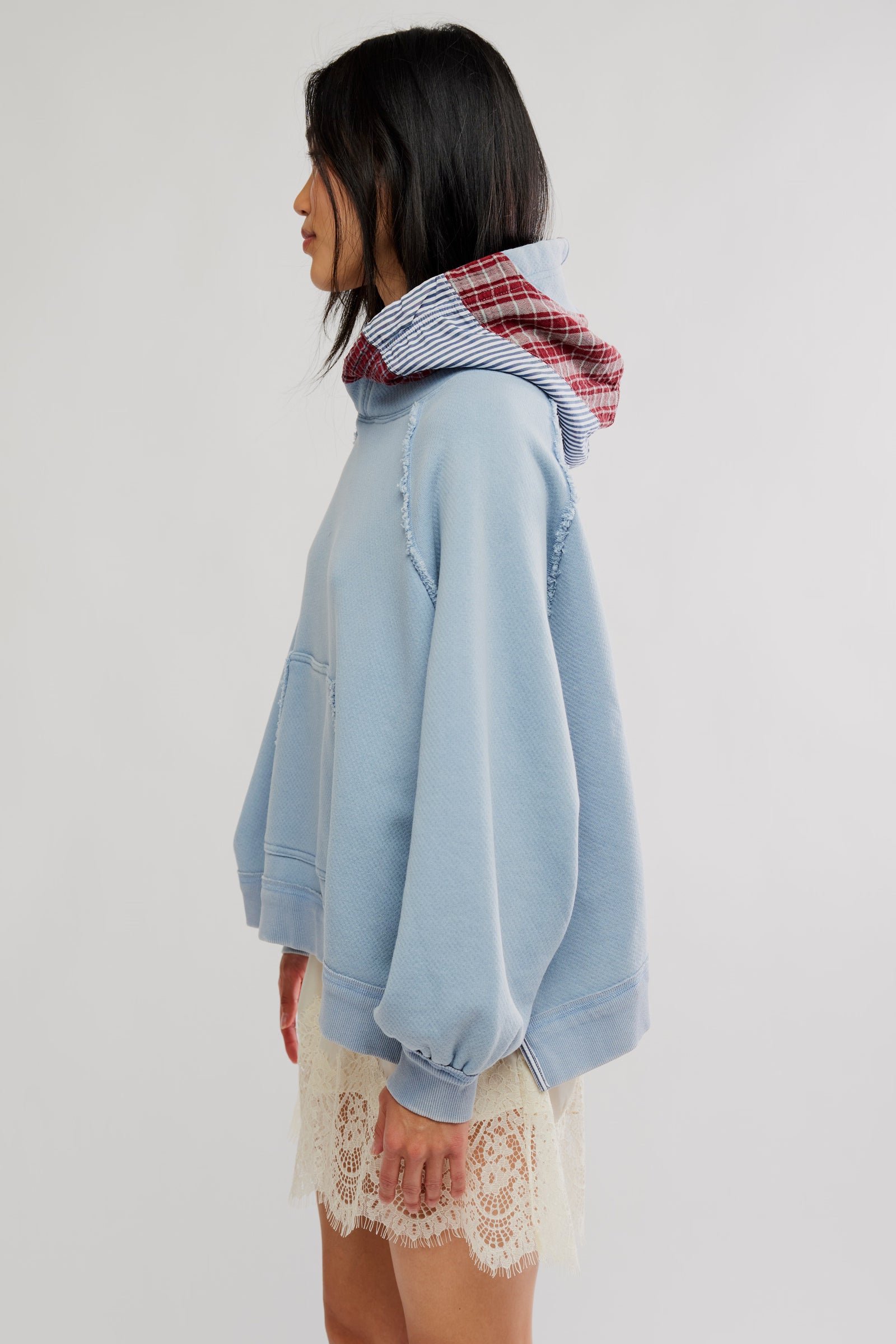Free People Countryside Hoodie in Autumn Sky on model wearing a lace skirt with white background-side view