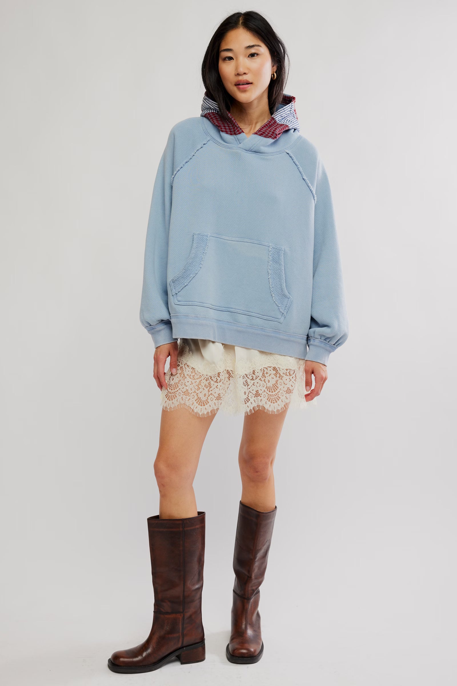 Free People Countryside Hoodie in Autumn Sky on model wearing a lace skirt and brown boots with white background