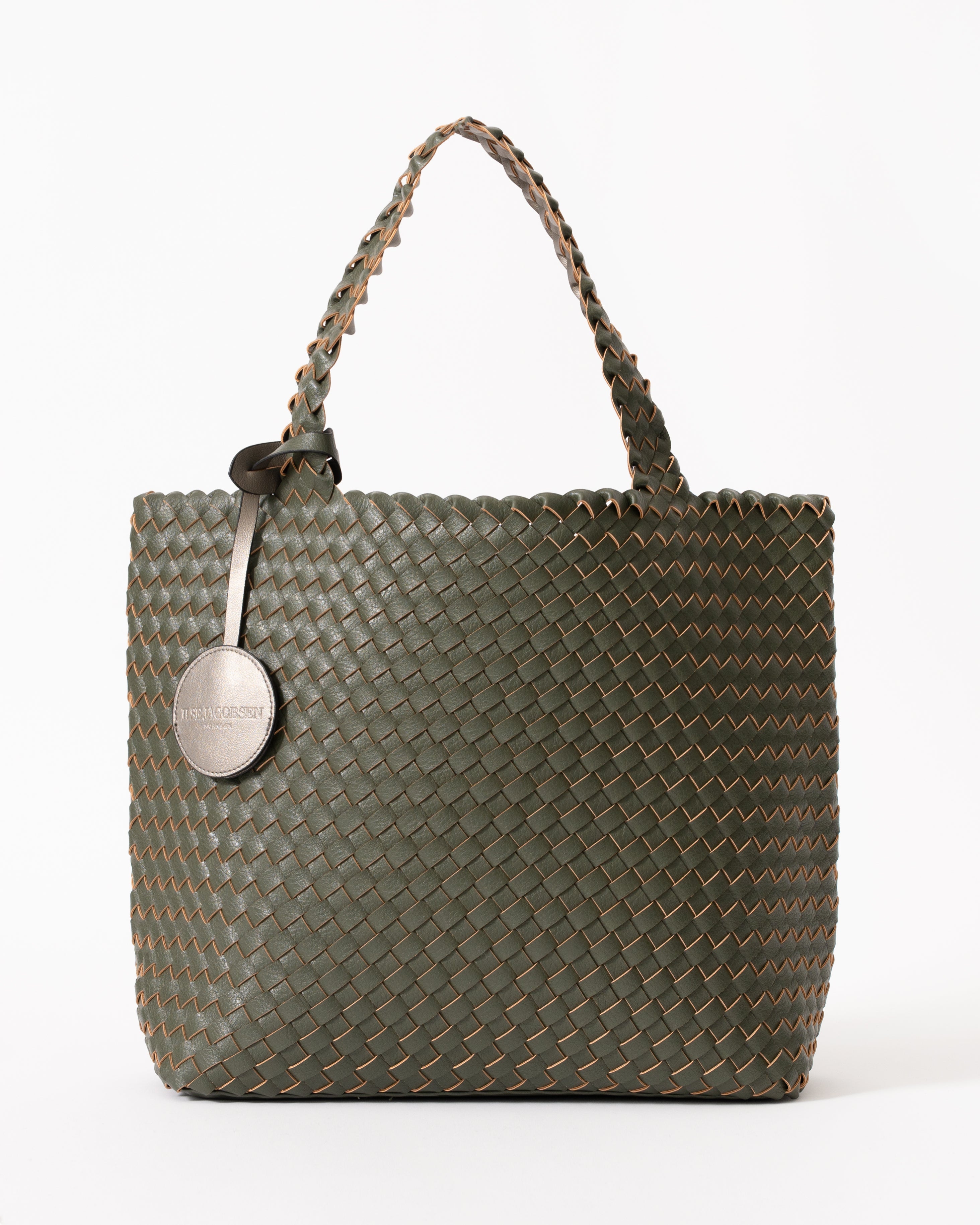 An olive green woven leather tote bag with braided shoulder straps and a round silver-tone metal hangtag, shown on a plain white background.