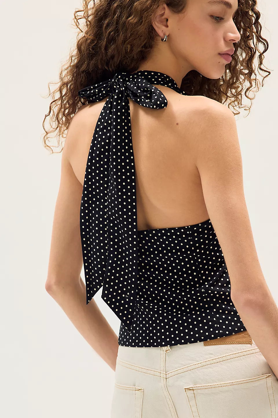 back view of Ramona Printed Halter Top in Black Combo black halter tank top with white poka-dots