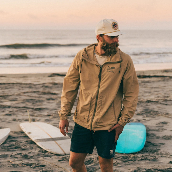 Howler Bros Seabreacher Jacket | Lark Model on beach