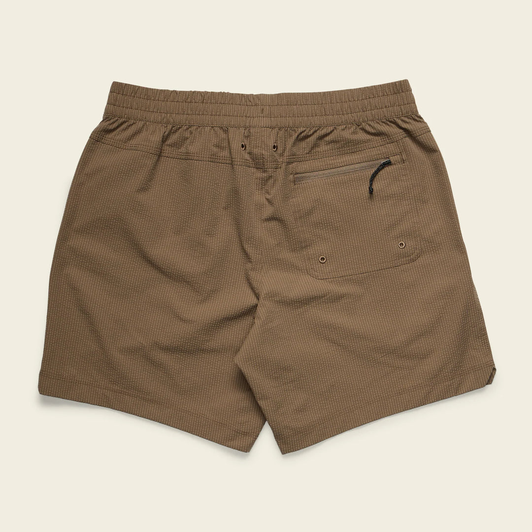 Brown shorts with a pocket on a beige background