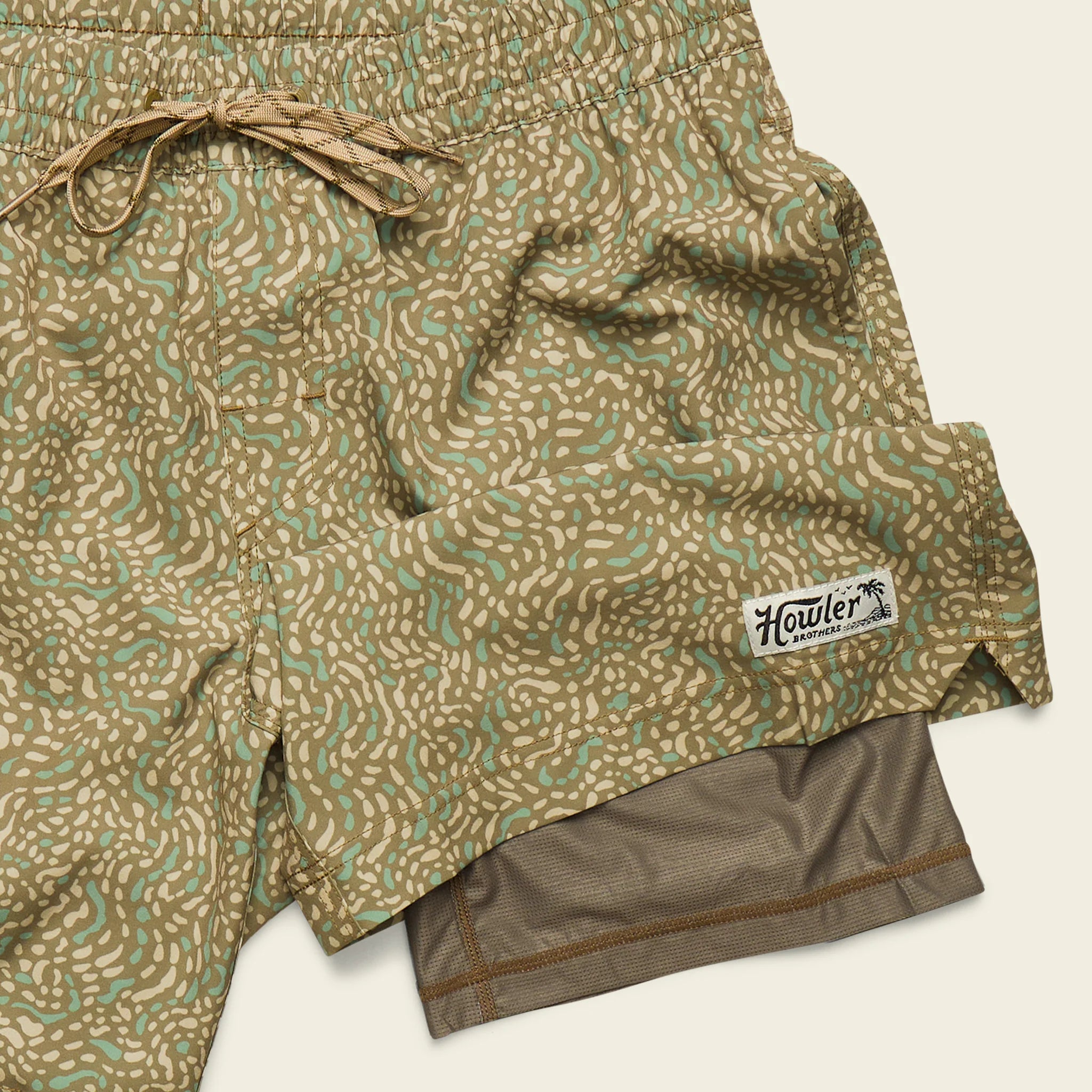 Patterned shorts with a visible brand label on a white background