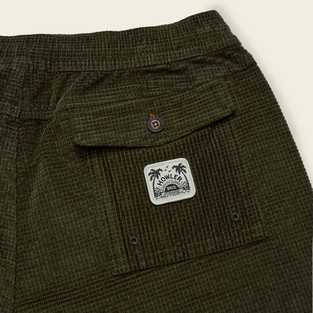 Green plaid pants with a brand logo on a white background