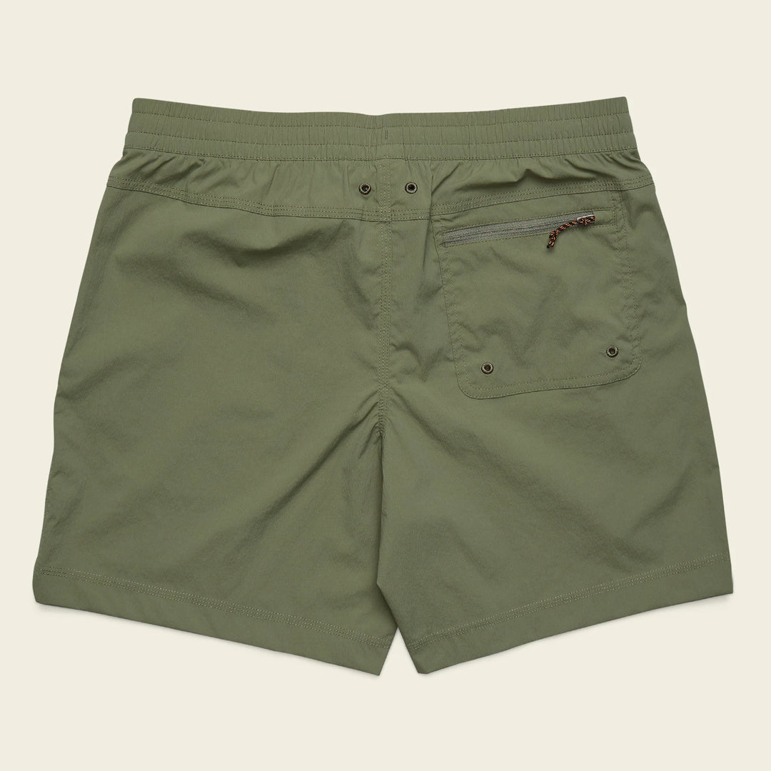 Green shorts with a pocket on a beige background