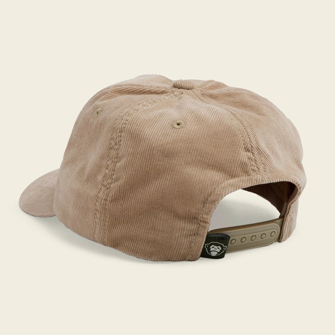 Beige corduroy cap on a beige background