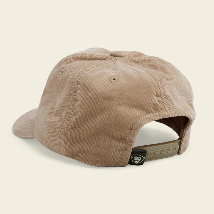 Beige corduroy cap on a beige background