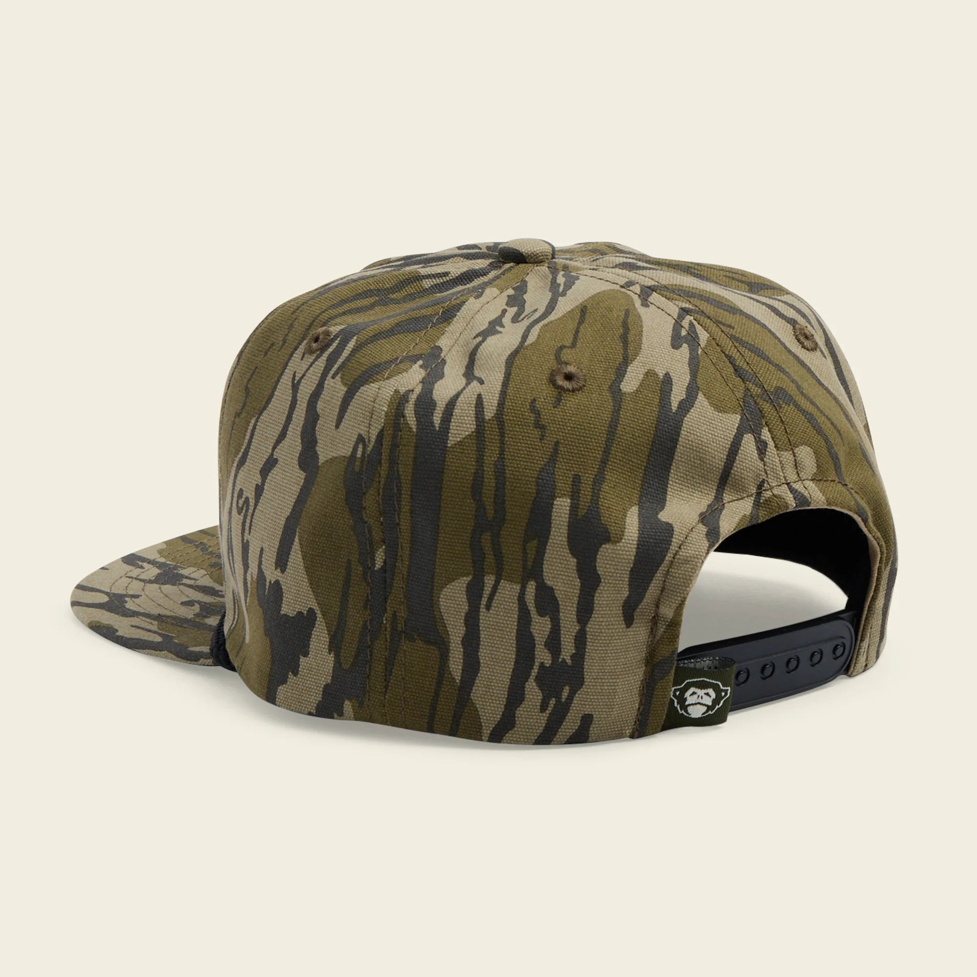 Camouflage-patterned cap on a beige background